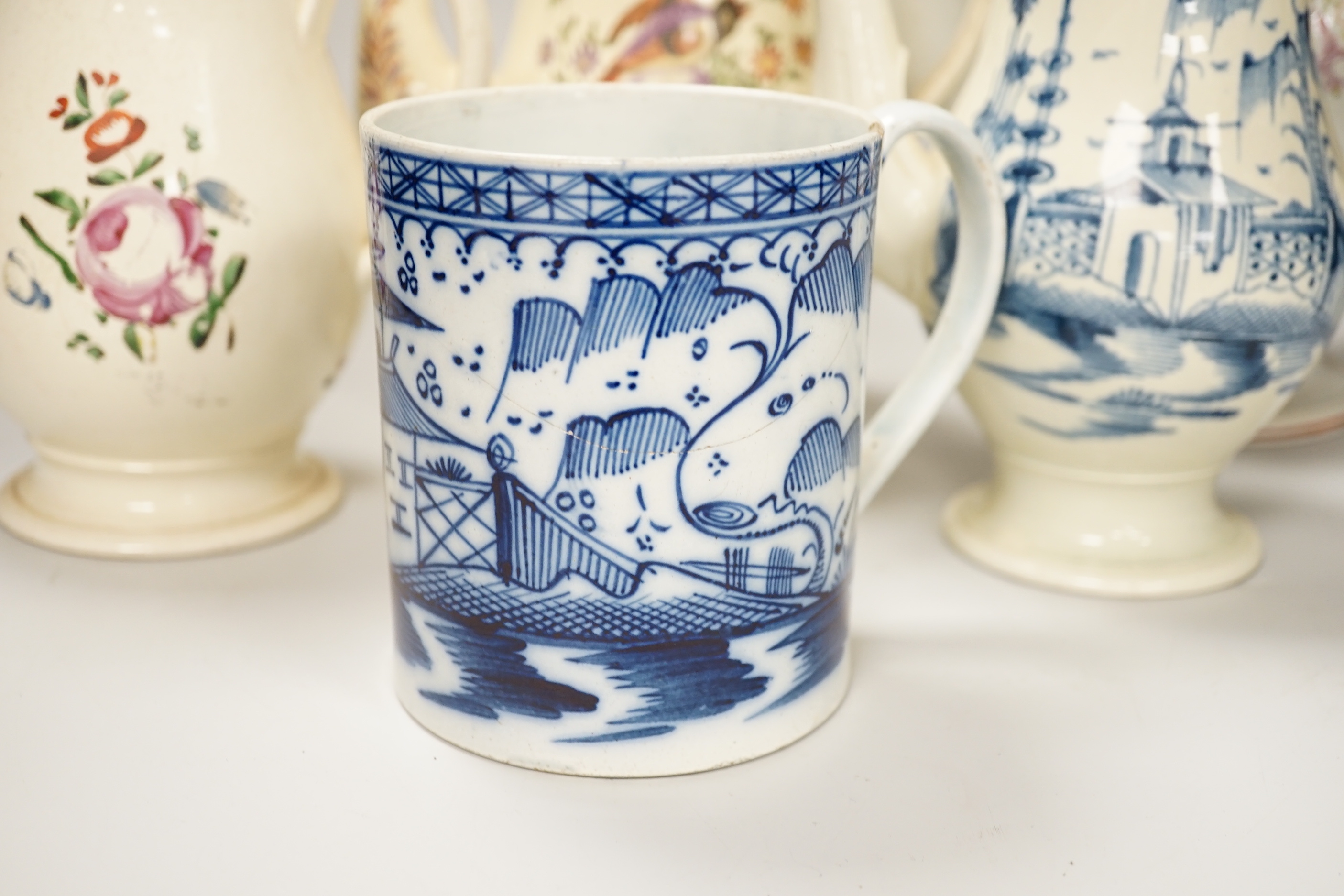 Three Georgian creamware and pearlware teapots, a jug and a mug, tallest 27cm